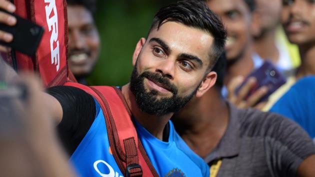 Indian cricket team skipper Virat Kohli poses for photo with his supporters. (AFP) Indian cricket team skipper Virat Kohli poses for photo with his supporters. (AFP)