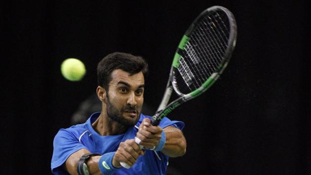 India's Yuki Bhambri returns to Canada's Denis Shapovalov during a Davis Cup tennis match in Edmonton, Alberta, Friday, Sept. 15, 2017.(AP) India's Yuki Bhambri returns to Canada's Denis Shapovalov during a Davis Cup tennis match in Edmonton, Alberta, Friday, Sept. 15, 2017.(AP)