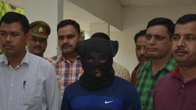 The police said that during the late night encounter, near Koyal Enclave in Sahibabad, they arrested two accused, Sunil Singh and Robin Singh. (Sakib Ali/HT Photo) The police said that during the late night encounter, near Koyal Enclave in Sahibabad, they arrested two accused, Sunil Singh and Robin Singh. (Sakib Ali/HT Photo)