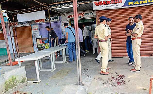 MIDC Police inspecting the spot at Gavalimatha Chowk in Bhosari MIDC where Vijay gholap was shot by two people in Pune, India, on Saturday. (HT PHOTO) MIDC Police inspecting the spot at Gavalimatha Chowk in Bhosari MIDC where Vijay gholap was shot by two people in Pune, India, on Saturday. (HT PHOTO)