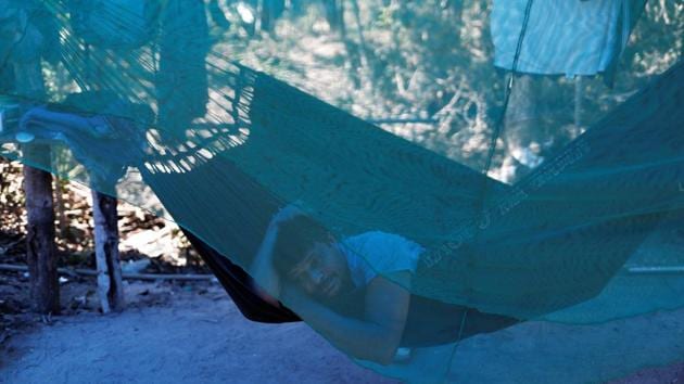 A wildcat gold miner, or garimpeiro, rests in a hammock at a wildcat mine. The Mining and Energy Ministry has said a new oversight agency created in a decree by President Michel Temer, now pending congressional approval, will allow more effective government coordination and inspections to restrict illegal mining. While the regulations target licensed miners, illegal mining remains a matter for the police. (Nacho Doce / REUTERS) A wildcat gold miner, or garimpeiro, rests in a hammock at a wildcat mine. The Mining and Energy Ministry has said a new oversight agency created in a decree by President Michel Temer, now pending congressional approval, will allow more effective government coordination and inspections to restrict illegal mining. While the regulations target licensed miners, illegal mining remains a matter for the police. (Nacho Doce / REUTERS)