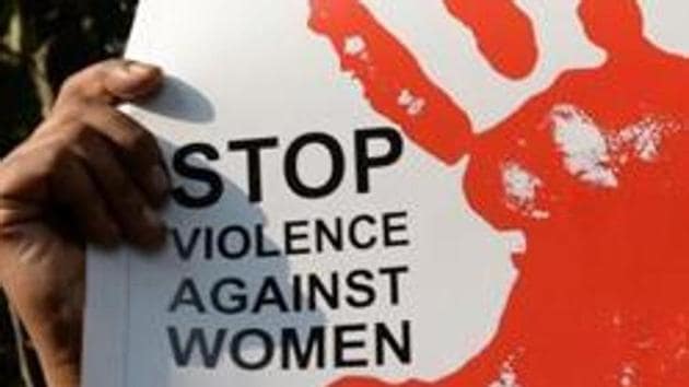 An activist hold placards during a protest against a rape at Hauz Khas village in New Delhi on February 21, 2017.(AFP File Photo)