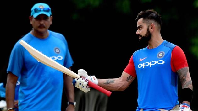 Indian cricket team captain Virat Kohli checks out the balance of his bat as head coach Ravi Shastri looks on during a practice session at MAC Stadium on the eve of the first ODI match against Australia cricket team in Chennai on Saturday. (PTI) Indian cricket team captain Virat Kohli checks out the balance of his bat as head coach Ravi Shastri looks on during a practice session at MAC Stadium on the eve of the first ODI match against Australia cricket team in Chennai on Saturday. (PTI)