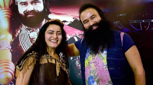 Gurmeet Ram Rahim Singh, seen here with Honeypreet Insan, faces trial in two murder cases.(PTI file photo)