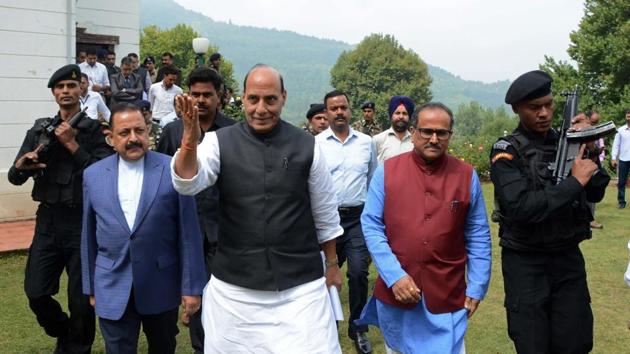 Rajnath Singh, along with MoS, PMO, Jitender Singh (L) and J-K deputy chief minister Nirmal Singh arrives to address a press conference in Srinagar on Monday.(PTI Photo)