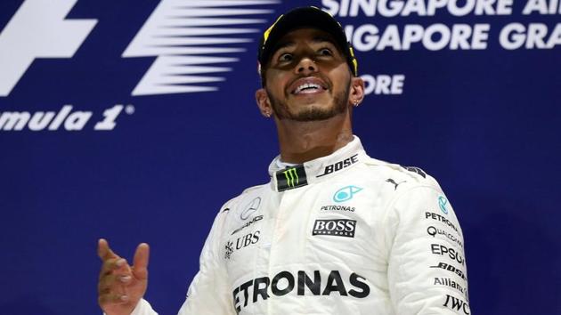 Lewis Hamilton won the Singapore Grand Prix to extend Championship lead over Sebastian Vettel to 28 points.(Twitter)