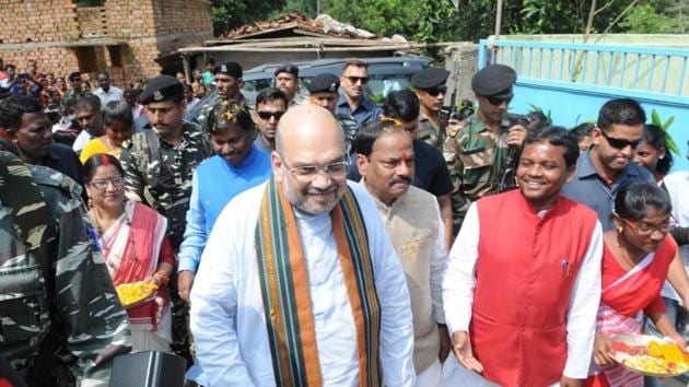 BJP President Amit Shah along with Chief Minister Raghubar Das and Former Chief Minister Arjun Munda visiting the residence of tribal Anil Oraon at Harmu locality in Ranchi, India, on Saturday, September 16, 2017. (Diwakar Prasad/ Hindustan Times) BJP President Amit Shah along with Chief Minister Raghubar Das and Former Chief Minister Arjun Munda visiting the residence of tribal Anil Oraon at Harmu locality in Ranchi, India, on Saturday, September 16, 2017. (Diwakar Prasad/ Hindustan Times)