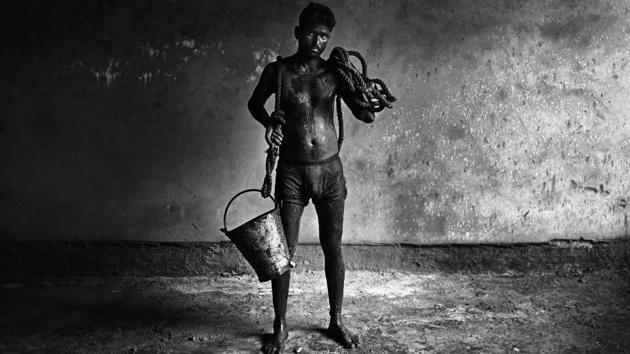 The stench that a sewer worker has to live with is unimaginable. Some workers disclose that even whey they eat their dinner at home, their hands smell of the sewers. (Ravi Choudhary / HT Photo)
