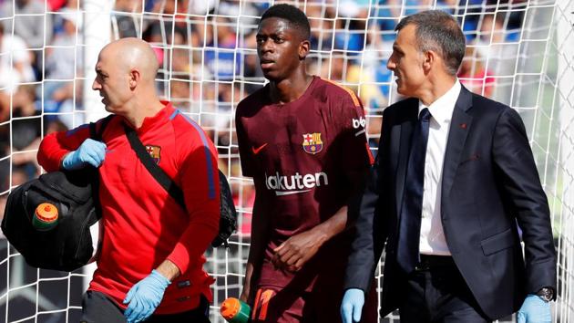 FC Barcelona's Ousmane Dembele receives medical attention after sustaining an injury.(REUTERS)