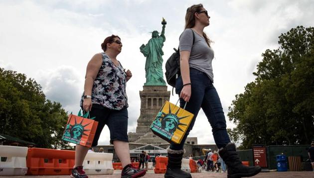 Tourists visiting the Statue of Liberty on Liberty Island in New York City. In 2016, the US witnessed 1.17 million arrivals from India who spent $13.6 billion there. (AFP) Tourists visiting the Statue of Liberty on Liberty Island in New York City. In 2016, the US witnessed 1.17 million arrivals from India who spent $13.6 billion there. (AFP)