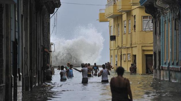 Cubans wade through a flooded street in Havana, on September 10, 2017. Deadly Hurricane Irma battered central Cuba on Saturday knocking down power lines, uprooting trees and ripping the roofs off homes as it headed towards Florida. Authorities said they had evacuated more than a million people as a precaution, including about 4,000 in the capital. (Yamil Lage / AFP) Cubans wade through a flooded street in Havana, on September 10, 2017. Deadly Hurricane Irma battered central Cuba on Saturday knocking down power lines, uprooting trees and ripping the roofs off homes as it headed towards Florida. Authorities said they had evacuated more than a million people as a precaution, including about 4,000 in the capital. (Yamil Lage / AFP)