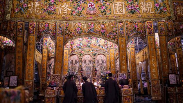 Toaist priests kneel to worship during an event to mark the Hungry Ghost Festival in Hong Kong on September 11, 2017. The festival, celebrated in the seventh lunar month of the lunar new year calendar among communities in southern China, Malaysia, Singapore, Hong Kong and Taiwan, marks the belief that the "Gates of Hell" are opened to let out the hungry ghosts who then wander in the land of the living while foraging for food. (Anthony Wallace / AFP) Toaist priests kneel to worship during an event to mark the Hungry Ghost Festival in Hong Kong on September 11, 2017. The festival, celebrated in the seventh lunar month of the lunar new year calendar among communities in southern China, Malaysia, Singapore, Hong Kong and Taiwan, marks the belief that the "Gates of Hell" are opened to let out the hungry ghosts who then wander in the land of the living while foraging for food. (Anthony Wallace / AFP)