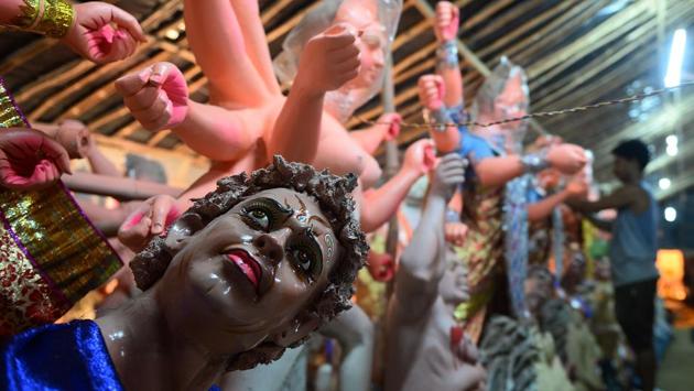 An Indian artist works on a statue of the Hindu goddess Durga ahead of the forthcoming Navratri Durga festival at a workshop in Allahabad on September 15, 2017. (Sanjay Kanojia / AFP) An Indian artist works on a statue of the Hindu goddess Durga ahead of the forthcoming Navratri Durga festival at a workshop in Allahabad on September 15, 2017. (Sanjay Kanojia / AFP)