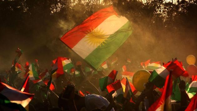 Iraqi Kurds fly Kurdish flags during an event to urge people to vote in the upcoming independence referendum in Arbil, the capital of the autonomous Kurdish region of northern Iraq, on September 15, 2017. Iraqi Kurdish lawmakers voted to hold an independence referendum set in motion by regional president Massud Barzani, who has kept open the option of postponing it under American pressure. (Safin Hamed / AFP) Iraqi Kurds fly Kurdish flags during an event to urge people to vote in the upcoming independence referendum in Arbil, the capital of the autonomous Kurdish region of northern Iraq, on September 15, 2017. Iraqi Kurdish lawmakers voted to hold an independence referendum set in motion by regional president Massud Barzani, who has kept open the option of postponing it under American pressure. (Safin Hamed / AFP)