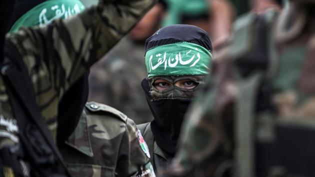 Masked youth cadets from the Ezzedine al-Qassam Brigades, the armed wing of the Palestinian Islamist Hamas movement, march in the southern Gaza Strip city of Khan Yunis on September 15, 2017. (AFP Photo) Masked youth cadets from the Ezzedine al-Qassam Brigades, the armed wing of the Palestinian Islamist Hamas movement, march in the southern Gaza Strip city of Khan Yunis on September 15, 2017. (AFP Photo)