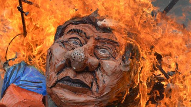 Anti-US protesters burn an effigy of Philippine President Rodrigo Duterte during a rally near the US embassy in Manila on September 15, 2017. The protesters marched to the US embassy to commemorate the Philippine Senate's voting on September 21, 1991 to end the continued stay of US military bases in the country, and accused the US of continued intervention in Mindanao island. (Ted Aljibe / AFP) Anti-US protesters burn an effigy of Philippine President Rodrigo Duterte during a rally near the US embassy in Manila on September 15, 2017. The protesters marched to the US embassy to commemorate the Philippine Senate's voting on September 21, 1991 to end the continued stay of US military bases in the country, and accused the US of continued intervention in Mindanao island. (Ted Aljibe / AFP)
