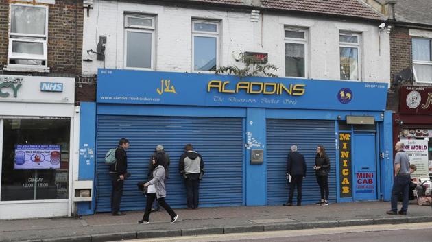 Members of the media wait outside Aladdins, a fast food restaurant at Hounslow in west London on September 18, 2017. The two suspects detained over last week's London subway bombing are an 18-year-old refugee from Iraq and a 21-year old from Syria, both of whom were fostered by a British couple. The teenager was detained on Saturday at the port of Dover and the 21-year-old was held later the same day in Hounslow.(AP) Members of the media wait outside Aladdins, a fast food restaurant at Hounslow in west London on September 18, 2017. The two suspects detained over last week's London subway bombing are an 18-year-old refugee from Iraq and a 21-year old from Syria, both of whom were fostered by a British couple. The teenager was detained on Saturday at the port of Dover and the 21-year-old was held later the same day in Hounslow.(AP)