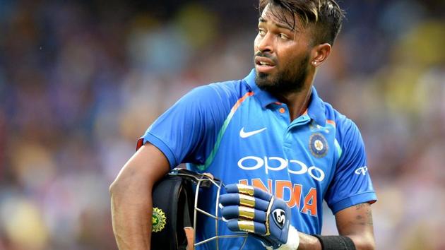 Indian cricket team all rounder Hardik Pandya walks back to the pavilion after scoring a career-best 83 off just 66 deliveries against Australia cricket team in the 1st ODI in Chennai. One can clearly make out the Mumbai Indians team colours in the gloves he used during the knock.(AFP)