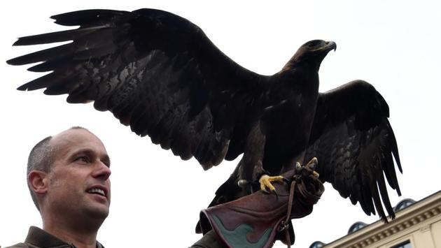 A huntsman with his eagle takes part in the traditional costume and riflemen parade. Security has been bolstered at the festival, with backpacks as well as large bags now being banned. The entrances will be watched over by more than 650 security guards, CCTV cameras and a new loudspeaker system, which can now be used to alert visitors in three languages: German, English and Bavarian. (Christof Stache / AFP) A huntsman with his eagle takes part in the traditional costume and riflemen parade. Security has been bolstered at the festival, with backpacks as well as large bags now being banned. The entrances will be watched over by more than 650 security guards, CCTV cameras and a new loudspeaker system, which can now be used to alert visitors in three languages: German, English and Bavarian. (Christof Stache / AFP)