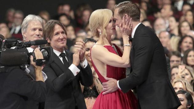 At Emmy Awards 2017, Nicole Kidman, left, congratulates Alexander Skarsgard with a kiss after he won the award for outstanding supporting actor in a limited series or a movie for Big Little Lies.(Invision for the Television Academy)