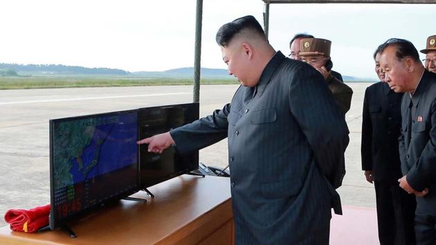 In this undated photo distributed on Saturday by the North Korean government, North Korean leader Kim Jong Un attends what was said to be the test launch of an intermediate range Hwasong-12 missile.(AP)