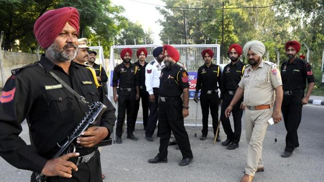 Punjab police personnel stand guard on the road leading to chief minister Amarinder Singh’s residence in Patiala on Monday. (Bharat Bhushan/HT) Punjab police personnel stand guard on the road leading to chief minister Amarinder Singh’s residence in Patiala on Monday. (Bharat Bhushan/HT)