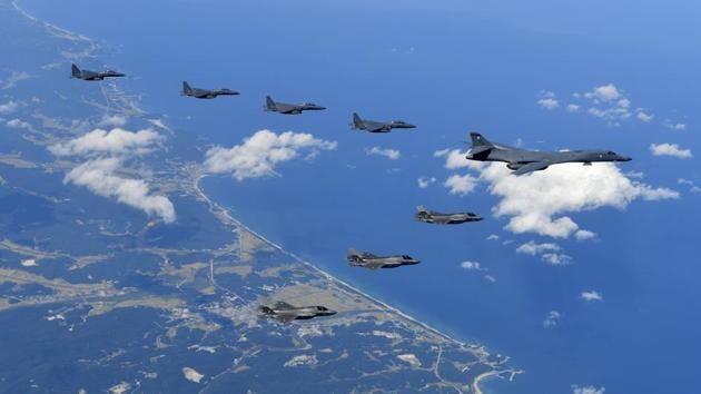 A photo provided by South Korea’s defence ministry shows US Air Force B-1B bomber, F-35B stealth fighter jets and South Korean F-15K fighter jets flying over the Korean Peninsula during joint drills on Monday.(AP)