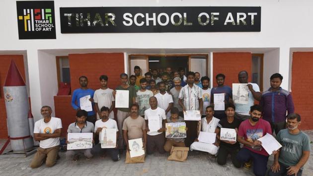 Most of the inmates had never held a brush before coming to jail, and now they wish to take up art as a career. Ramesh Kumar, 23, facing murder charges, says he wants to earn his living as an artist. Proudly showing a painting of a ghat in Varanasi, he frankly admits it is part copy of a work he saw in a newspaper. ‘Art has helped me forget memories that otherwise made me miserable every moment,’ said Ramesh. (Vipin Kumar / HT Photo) Most of the inmates had never held a brush before coming to jail, and now they wish to take up art as a career. Ramesh Kumar, 23, facing murder charges, says he wants to earn his living as an artist. Proudly showing a painting of a ghat in Varanasi, he frankly admits it is part copy of a work he saw in a newspaper. ‘Art has helped me forget memories that otherwise made me miserable every moment,’ said Ramesh. (Vipin Kumar / HT Photo)