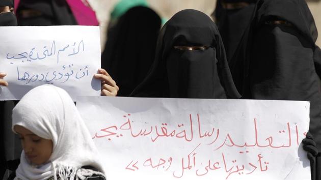Yemeni women and children demonstrate outside of the UN office demanding the end of targeting educational institutions by airstrikes and shelling, in the capital Sanaa, on Sunday.(AFP)