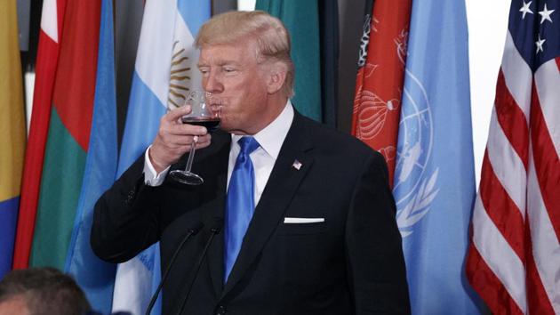 US President Donald Trump sips from a glass after giving a toast during a luncheon at the United Nations Tuesday. (AP Photo) US President Donald Trump sips from a glass after giving a toast during a luncheon at the United Nations Tuesday. (AP Photo)