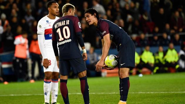 Paris Saint-Germain's Uruguayan forward Edinson Cavani (R) speaks with Brazilian teammate Neymar (C) during a Ligue 1 football match against Olympique Lyonnais at the Parc des Princes Stadium in Paris. (AFP) Paris Saint-Germain's Uruguayan forward Edinson Cavani (R) speaks with Brazilian teammate Neymar (C) during a Ligue 1 football match against Olympique Lyonnais at the Parc des Princes Stadium in Paris. (AFP)