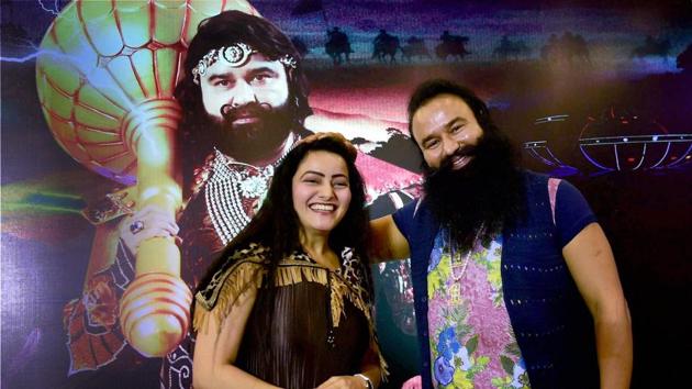 File photo of Dera Sacha Sauda chief Gurmeet Ram Rahim Singh with his adopted daughter at the promotion of the film ‘MSG - The Warrior Lion Heart’ in Bengaluru last year. (PTI) File photo of Dera Sacha Sauda chief Gurmeet Ram Rahim Singh with his adopted daughter at the promotion of the film ‘MSG - The Warrior Lion Heart’ in Bengaluru last year. (PTI)