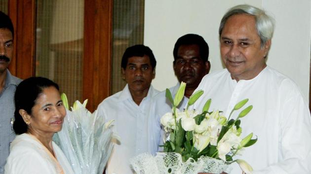 Odisha chief Minister Naveen Patnaik greets his West Bengal counterpart Mamata Banerjee at his residence in Bhubaneswar. The popularity of powerful regional leaders like Mamata Banerjee and Naveen Patnaik shows no signs of waning dramatically even if fraying at the edges(PTI)