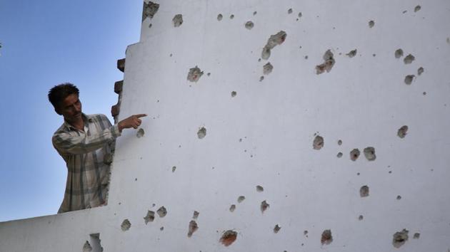 A Villager shows the damaged wall of his house after a heavy mortar shelling by Pakistani rangers on Saturday night, at Arnia village, Jammu, on September 17. (Nitin Kanotra/ HT File Photo) A Villager shows the damaged wall of his house after a heavy mortar shelling by Pakistani rangers on Saturday night, at Arnia village, Jammu, on September 17. (Nitin Kanotra/ HT File Photo)