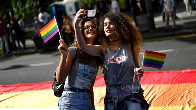 Two women take a selfie during the Gay Pride parade on September 17, 2017 in Belgrade. Serbia’s embattled LGBT residents face widespread harassment and violence from extremists. Violence marred the first pride march in 2001, and more than 100 people were injured during an event in 2010 when police clashed with right-wing groups and soccer hooligans. Several pride events were banned before marches resumed in 2014. (Andrej Isakovic / AFP) Two women take a selfie during the Gay Pride parade on September 17, 2017 in Belgrade. Serbia’s embattled LGBT residents face widespread harassment and violence from extremists. Violence marred the first pride march in 2001, and more than 100 people were injured during an event in 2010 when police clashed with right-wing groups and soccer hooligans. Several pride events were banned before marches resumed in 2014. (Andrej Isakovic / AFP)