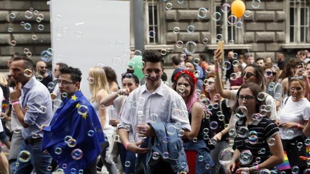 People dance during gay pride march in Belgrade, Serbia on Sunday, September 17, 2017. Brnabic attended the pride march last year when she was public administration minister in the previous government of now-President Aleksandar Vucic. A former ultranationalist who now identifies as a pro-EU reformer, Vucic has declined invitations to attend the pride march. (Darko Vojinovic / AP) People dance during gay pride march in Belgrade, Serbia on Sunday, September 17, 2017. Brnabic attended the pride march last year when she was public administration minister in the previous government of now-President Aleksandar Vucic. A former ultranationalist who now identifies as a pro-EU reformer, Vucic has declined invitations to attend the pride march. (Darko Vojinovic / AP)