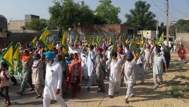 Farmers march in Longowal on Wednesday.(HT Photo)