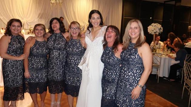 Six women turned up at a wedding in Sydney wearing similar dresses but they were not the bridesmaids.(Debbie Speranza’s Facebook page)