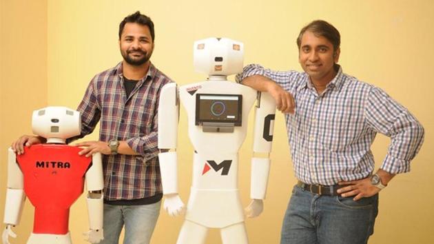 File photo of Balaji Viswanathan (right), one of the founders of Bengaluru-based Invento Robotics, and the Mitra robot.(Twitter)