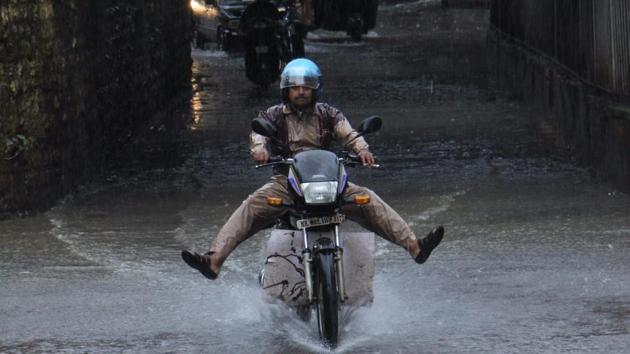 Widespread rain overnight left many parts of Mumbai waterlogged. A man rides through the waterlogged Malad Subway on Wednesday morning. (Pramod Thakur/hindustan times) Widespread rain overnight left many parts of Mumbai waterlogged. A man rides through the waterlogged Malad Subway on Wednesday morning. (Pramod Thakur/hindustan times)