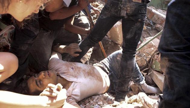 A man is rescued from a collapsed building in the Condesa neighbourhood of Mexico City after an earthquake on Tuesday. (AP) A man is rescued from a collapsed building in the Condesa neighbourhood of Mexico City after an earthquake on Tuesday. (AP)