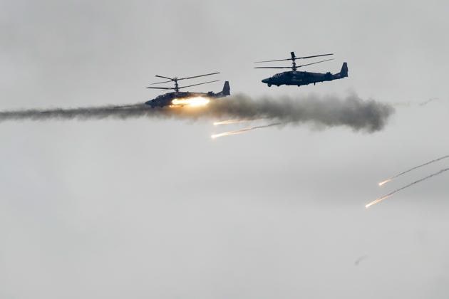 Military helicopters fire during the Zapad 2017 Russia-Belarus military exercises at the Borisovsky range in Borisov, Belarus on September 20, 2017. (AP) Military helicopters fire during the Zapad 2017 Russia-Belarus military exercises at the Borisovsky range in Borisov, Belarus on September 20, 2017. (AP)