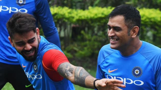 Virat Kohli and MS Dhoni share a light moment during practice. (AFP) Virat Kohli and MS Dhoni share a light moment during practice. (AFP)