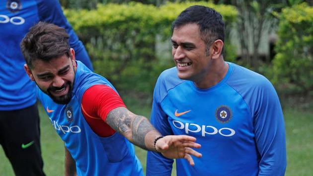 Virat Kohli and MS Dhoni share a light moment during India’s practice session as the Eden Gardens remained out of bounds thanks to rain and a wet outfield. (REUTERS) Virat Kohli and MS Dhoni share a light moment during India’s practice session as the Eden Gardens remained out of bounds thanks to rain and a wet outfield. (REUTERS)