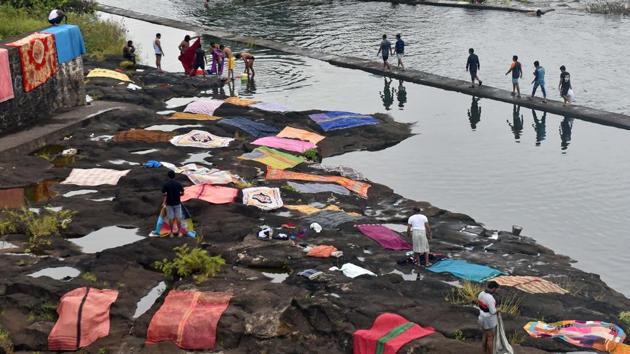 Clothes put to dry after being washed at Khadakwasla dam. (Pratham Gokhale/HT PHOTO) 