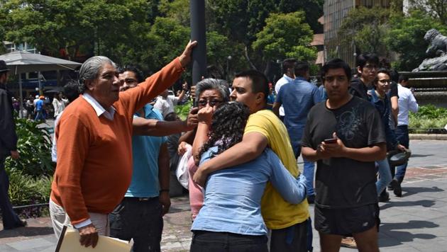 People react as a earthquake rattles Mexico City. (AFP Photo) People react as a earthquake rattles Mexico City. (AFP Photo)