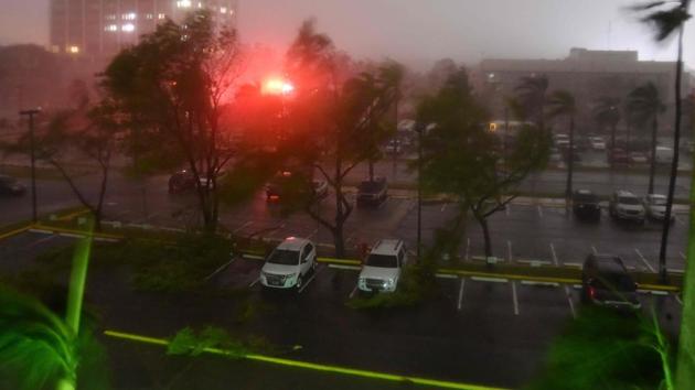 Branches lie on the ground as trees blow in the wind from the passage of the Hurricane Maria, seen outside Roberto Clemente Coliseum where residents have sought shelter in San Juan, Puerto Rico, early on September 20, 2017.(AFP Photo)