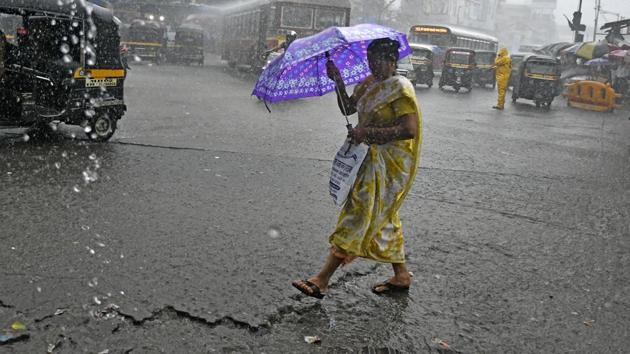 Five Western Railway trains have been cancelled. On Central Railways, six trains were cancelled and two diverted due to heavy rainfall. Here, people are seen traversing the rain in Andheri, Mumbai. (Shashi S Kashyap / HT Photo) Five Western Railway trains have been cancelled. On Central Railways, six trains were cancelled and two diverted due to heavy rainfall. Here, people are seen traversing the rain in Andheri, Mumbai. (Shashi S Kashyap / HT Photo)