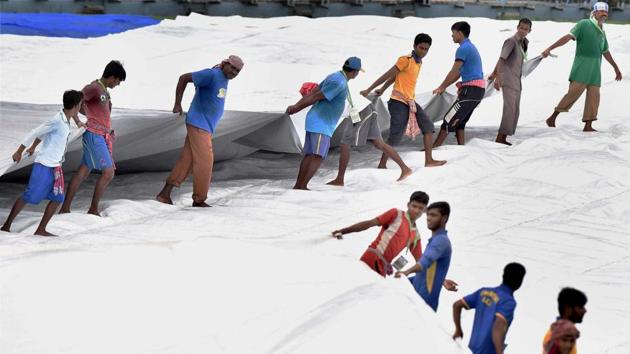 Rain continued to play hide and seek and it was a frustrating day for the ground staff. (PTI) Rain continued to play hide and seek and it was a frustrating day for the ground staff. (PTI)