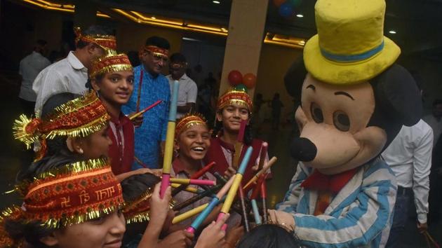 Hearing impaired children play Garba with a mascot of Mickey Mouse during an event organised by Niranjan Sevabhavi Sanstha on marking the beginning of the Navratri festival in Pune on Wednesday. (Pratham Gokhale/HT PHOTO) Hearing impaired children play Garba with a mascot of Mickey Mouse during an event organised by Niranjan Sevabhavi Sanstha on marking the beginning of the Navratri festival in Pune on Wednesday. (Pratham Gokhale/HT PHOTO)